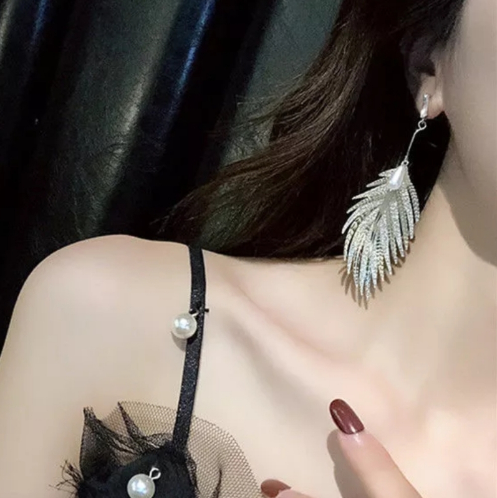 Silver feather drop earrings